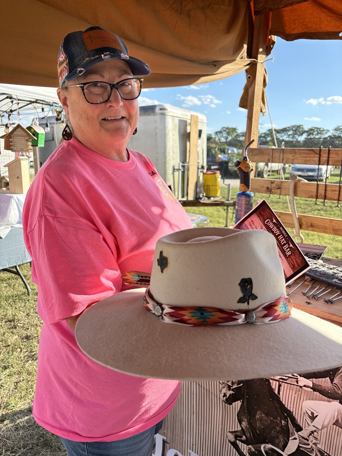 A guest showing her custom hat